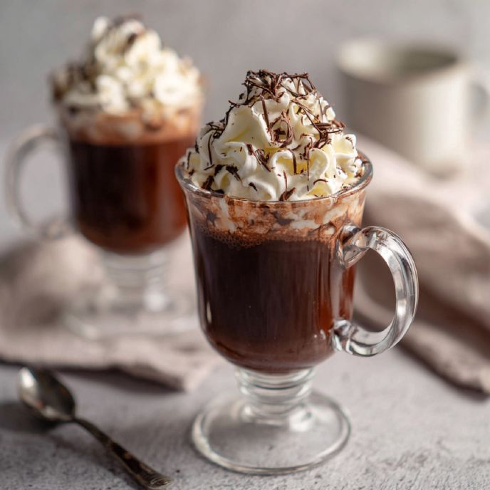 French Hot Chocolate in a glass mug with whipped cream