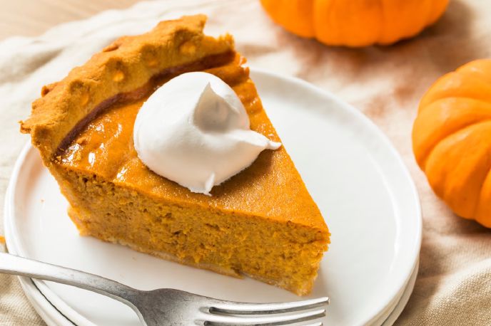 Dairy-free pumpkin pie slice with coconut whipped cream